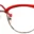 A pair of glasses with red frames on top.