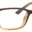 A pair of glasses is shown with the frame in focus.