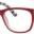 A pair of red glasses with black and white pattern on the side.