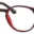 A pair of glasses is shown with red frames.